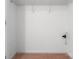 Walk-in closet showing carpeted floor, wire shelving, and utility hookups at 3296 Saddlebrook Dr, Midland, NC 28107