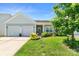 Charming single-story home with a manicured lawn, two-car garage, and inviting front porch at 3296 Saddlebrook Dr, Midland, NC 28107