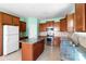 Well-lit kitchen with stainless steel appliances, granite countertops, an island, and ample cabinetry at 3296 Saddlebrook Dr, Midland, NC 28107