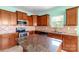 Bright kitchen with stainless steel appliances, granite countertops, stylish cabinetry, and an island at 3296 Saddlebrook Dr, Midland, NC 28107