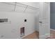 Laundry room with hookups, shelving, and access to another room at 3296 Saddlebrook Dr, Midland, NC 28107