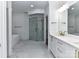 Spa-like bathroom showcasing a modern shower, standalone tub, gold fixtures, and elegant tiling for a relaxing retreat at 344 S Laurel Ave, Charlotte, NC 28207
