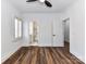 Cozy bedroom featuring a view of the ensuite bathroom, a modern ceiling fan, and beautiful wood-look flooring at 344 S Laurel Ave, Charlotte, NC 28207