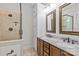 Bathroom featuring a luxurious shower, a vanity with double sinks, and elegant fixtures for a spa-like experience at 3535 Selwyn Farms Ln, Charlotte, NC 28209