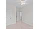 Bedroom with neutral carpet, two doors and a ceiling fan at 3535 Selwyn Farms Ln, Charlotte, NC 28209