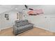 Cozy bedroom featuring comfortable gray seating, a unique ceiling fan, and a captivating mural at 3535 Selwyn Farms Ln, Charlotte, NC 28209
