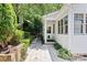 Charming home exterior featuring a covered entrance and a beautifully landscaped walkway at 3535 Selwyn Farms Ln, Charlotte, NC 28209