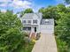 Traditional two-story home with attached garage, well-manicured lawn, and inviting front porch at 3535 Selwyn Farms Ln, Charlotte, NC 28209