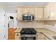 Well-equipped kitchen featuring stainless steel appliances, granite countertops, and ample cabinet space at 3535 Selwyn Farms Ln, Charlotte, NC 28209