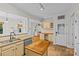 Bright kitchen featuring granite countertops, an island, stainless steel appliances and an eat-in area at 3535 Selwyn Farms Ln, Charlotte, NC 28209