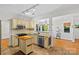 Bright and open kitchen with stainless steel appliances, granite countertops, and a convenient island at 3535 Selwyn Farms Ln, Charlotte, NC 28209