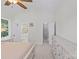 Bright main bedroom featuring an ensuite bathroom, a ceiling fan and a large dresser at 3535 Selwyn Farms Ln, Charlotte, NC 28209