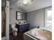Bright bathroom with double sinks, a soaking tub, and a separate shower enclosure at 3607 Austin Rd, Monroe, NC 28112