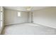 Bedroom featuring light grey carpet and walls, ceiling fan and a single window at 3607 Austin Rd, Monroe, NC 28112