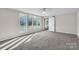 Bright bedroom with many windows and light colored walls and carpet at 3607 Austin Rd, Monroe, NC 28112
