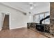 A cozy living room featuring tile floors and stone fireplace at 3607 Austin Rd, Monroe, NC 28112