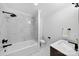 This bathroom features white marble tile in the tub and shower area, and modern fixtures at 3981 Spinnaker Pl, Denver, NC 28037