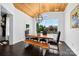 Charming dining area with wood ceiling, large window, and a rustic table with seating for six at 3981 Spinnaker Pl, Denver, NC 28037