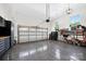 Spacious garage with cabinets, shiny floors, and room for vehicles, perfect for storage and hobbies at 3981 Spinnaker Pl, Denver, NC 28037