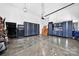 Spacious garage with shiny floors, storage cabinets, and room for vehicles, perfect for storage and hobbies at 3981 Spinnaker Pl, Denver, NC 28037