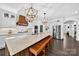 A bright kitchen featuring a large marble island, wooden accents, and stainless steel appliances at 3981 Spinnaker Pl, Denver, NC 28037