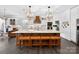 Modern kitchen with a large center island, custom lighting, stylish seating, and open concept design at 3981 Spinnaker Pl, Denver, NC 28037