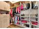 Well-organized walk-in closet with custom shelving for clothing, shoes, and accessories at 3981 Spinnaker Pl, Denver, NC 28037