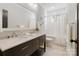 Bathroom with double sinks, a large mirror, and a shower/tub combo at 508 Mcalway Rd, Charlotte, NC 28211