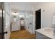 Bright bathroom featuring a glass enclosed shower, double vanity and natural light at 508 Mcalway Rd, Charlotte, NC 28211