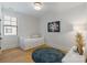 Charming bedroom with natural light, hardwood floors, and decorative rug at 508 Mcalway Rd, Charlotte, NC 28211