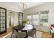 Bright dining area with round table and chairs in a room filled with sunlight at 508 Mcalway Rd, Charlotte, NC 28211