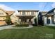 Charming two-story home with a welcoming front porch, well-maintained lawn, and a mix of modern and classic architectural styles at 508 Mcalway Rd, Charlotte, NC 28211