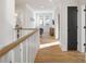 Bright hallway with wood floors, white trim, and natural light at 508 Mcalway Rd, Charlotte, NC 28211