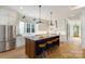 Bright kitchen with a large island, stainless steel appliances, and custom cabinetry at 508 Mcalway Rd, Charlotte, NC 28211