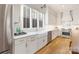 This kitchen is equipped with stainless steel appliances, white marble counter tops and wood flooring at 508 Mcalway Rd, Charlotte, NC 28211