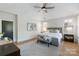 Bright main bedroom featuring many windows, sitting area, and neutral decor at 508 Mcalway Rd, Charlotte, NC 28211