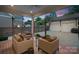 Covered patio with cozy outdoor seating, ceiling fan, and view of backyard at 508 Mcalway Rd, Charlotte, NC 28211