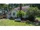 Spacious backyard featuring a charming house and a large propane tank at 5560 Springs Rd, Conover, NC 28613
