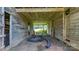 Interior view of the barn with wooden frame, offering a glimpse into its spacious layout and design at 5560 Springs Rd, Conover, NC 28613