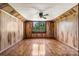 Bright room featuring wood paneled walls and a large window at 5560 Springs Rd, Conover, NC 28613