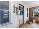 Entryway of home with metal bucket and rusty metal pieces, multiple windows and door at 5560 Springs Rd, Conover, NC 28613