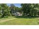 Charming home nestled among mature trees, featuring a sunroom and ample green space, creating a private and serene setting at 5560 Springs Rd, Conover, NC 28613