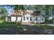 Inviting exterior with a cozy porch, classic white siding, and well-maintained landscaping, offering a charming curb appeal at 5560 Springs Rd, Conover, NC 28613