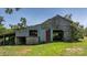 Rustic barn with classic wooden structure, adding character to the property's landscape at 5560 Springs Rd, Conover, NC 28613
