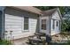 Cozy outdoor patio with a stone table and seating, perfect for relaxing or entertaining guests at 5560 Springs Rd, Conover, NC 28613