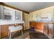 Room with mixed wood panelling, wood floors, window and a serving table at 5560 Springs Rd, Conover, NC 28613