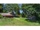 Expansive yard featuring outbuildings and mature trees, offering a serene and private setting at 5560 Springs Rd, Conover, NC 28613