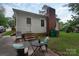 Cozy backyard patio with seating, perfect for outdoor dining and enjoying the tranquil surroundings at 5727 Faulconbridge Rd, Charlotte, NC 28227