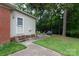 Charming backyard with patio, seating area, and lush greenery, ideal for relaxation and outdoor entertaining at 5727 Faulconbridge Rd, Charlotte, NC 28227