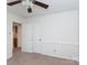 Clean bedroom shows the spacious layout, ceiling fan, closet, and carpeted floor at 5727 Faulconbridge Rd, Charlotte, NC 28227